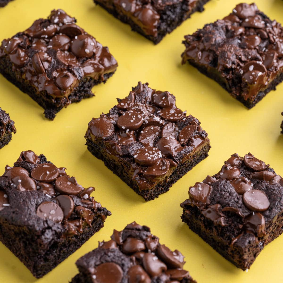 Rows of Fudgy Chocolate Brownies on yellow background