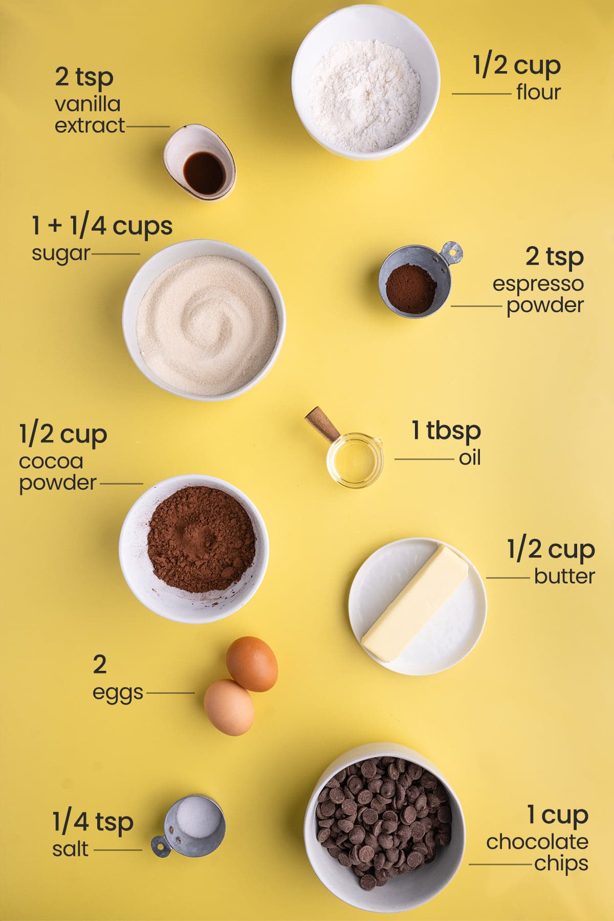Ingredients for One-Bowl Fudgy Chocolate Brownies including flour, vanilla extract, espresso powder, granulated sugar, oil, cocoa powder, unsalted butter, eggs, salt, and chocolate chips