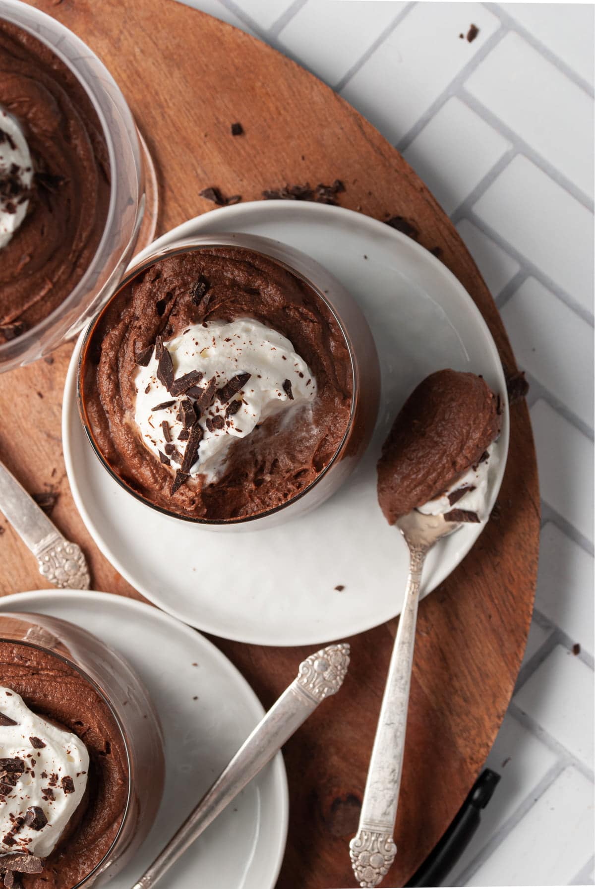 a glass of boozy chocolate mousse with a spoonful scooped out