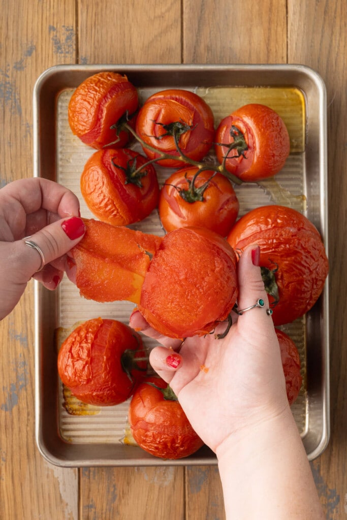 Easily peeling the outer skin off of a roasted tomato.