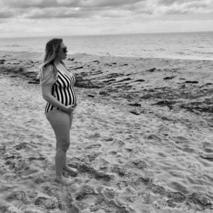 You Can Hate Being Pregnant But Love Being A Mom - On The Beach | FurloughedFoodie.com