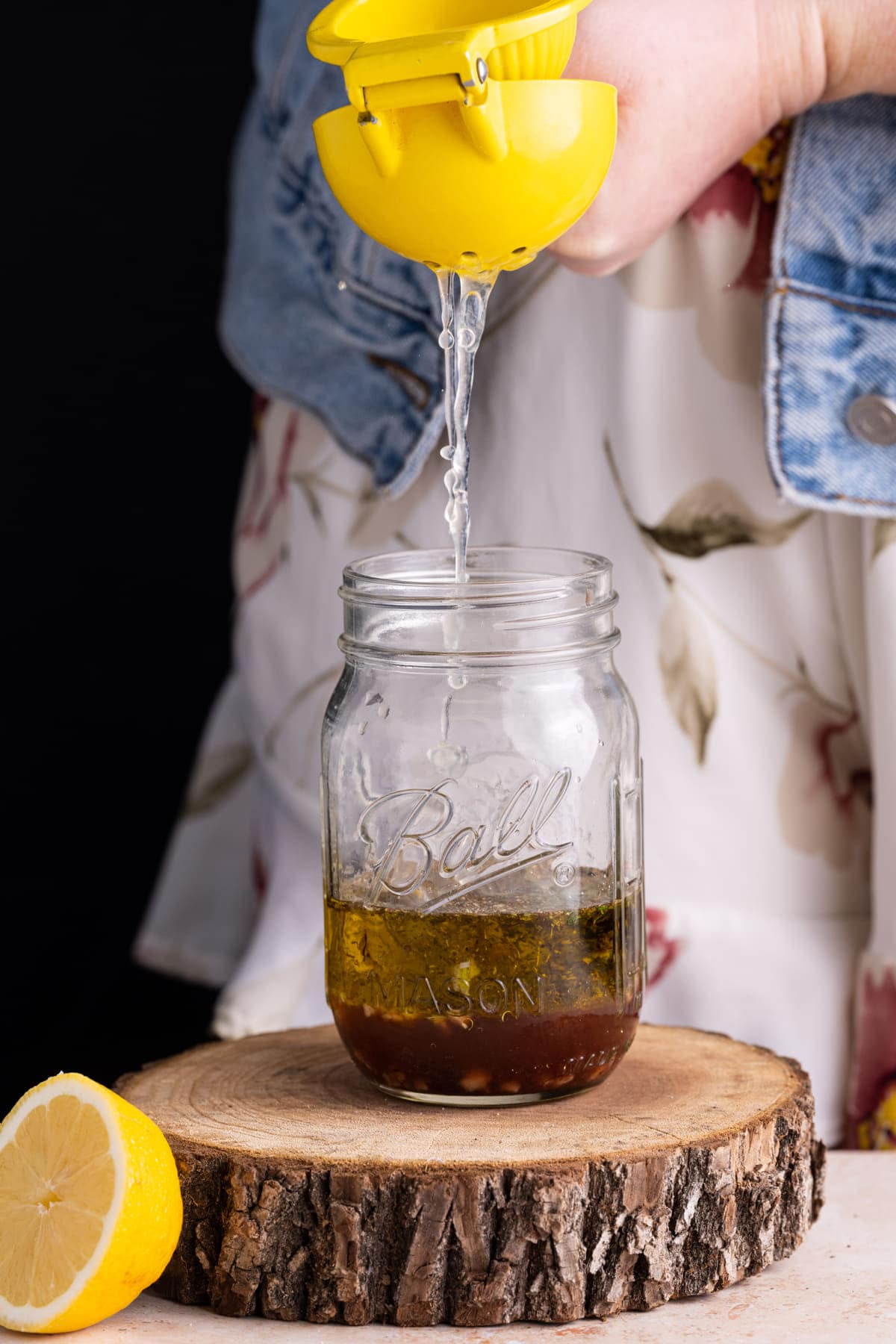 Adding fresh lemon juice to homemade dressing