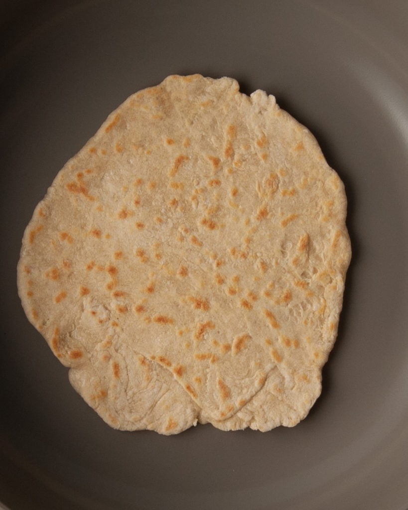 frying a tortilla on a pan