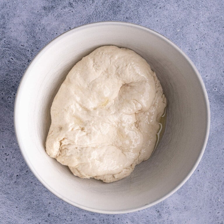 Pretzel dough rising in large mixing bowl