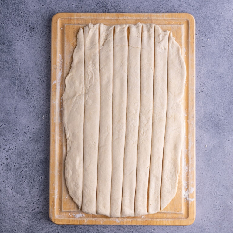 Pretzel dough sliced into thin strips