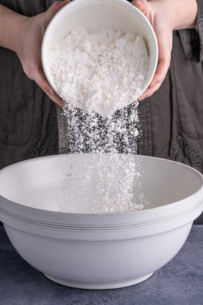 Adding flour to pretzel dough