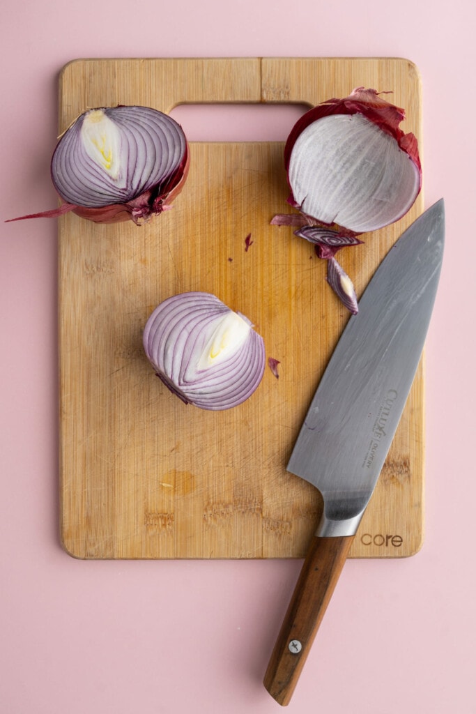 Slicing onion in half and chopping ends off
