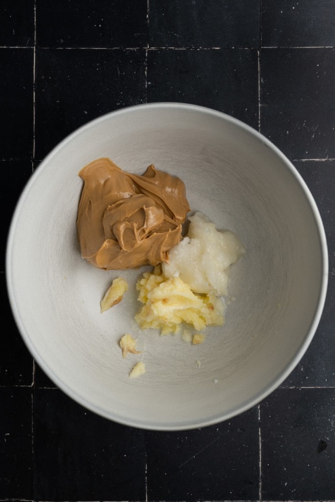 butter, peanut butter, and coconut oil in a large mixing bowl