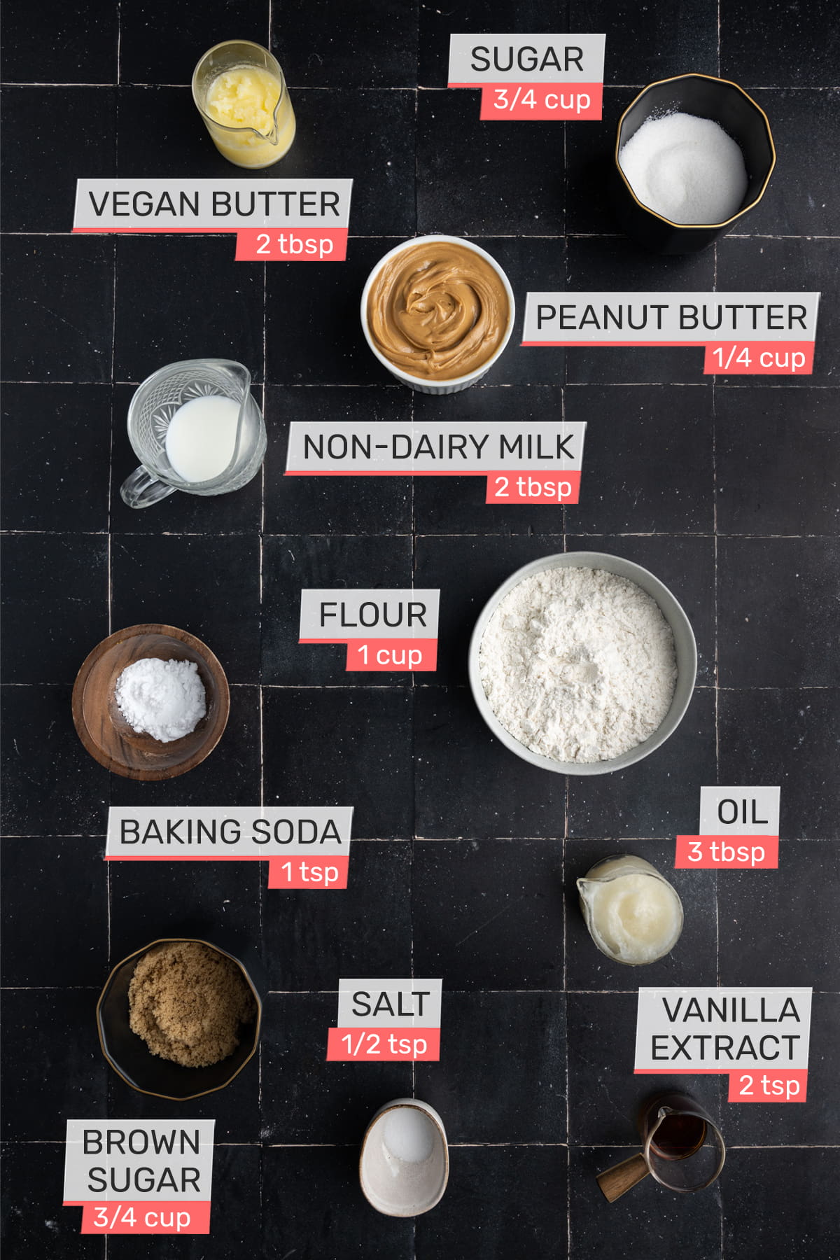 Overhead view of all ingredients for Vegan Peanut Butter Biscuits - sugar, vegan butter, peanut butter, non-dairy milk, flour, baking soda, oil, salt, vanilla extract, brown sugar
