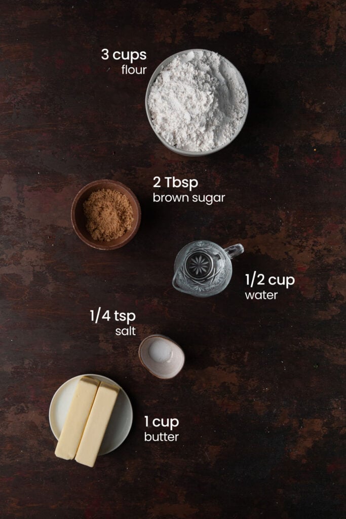 Everything you need to make crust for Drunken Apple Pie including flour, brown sugar, water, salt, and butter.