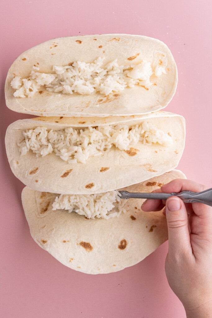 Three tortillas filled with coconut rice