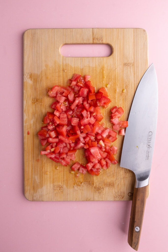 Dicing tomato on a cutting board