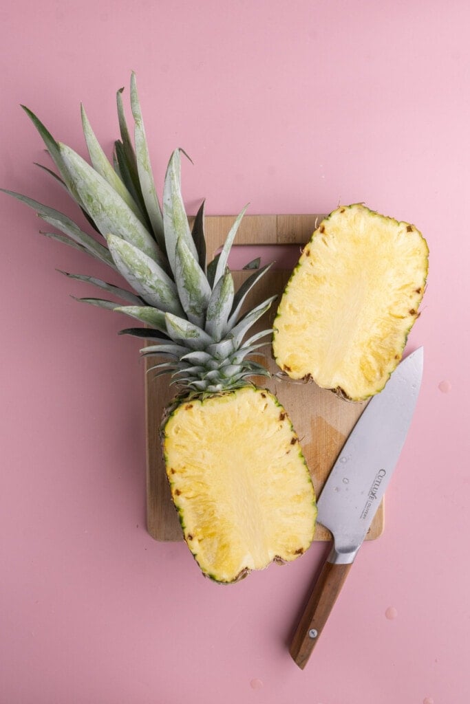 Slicing whole pineapple next to core