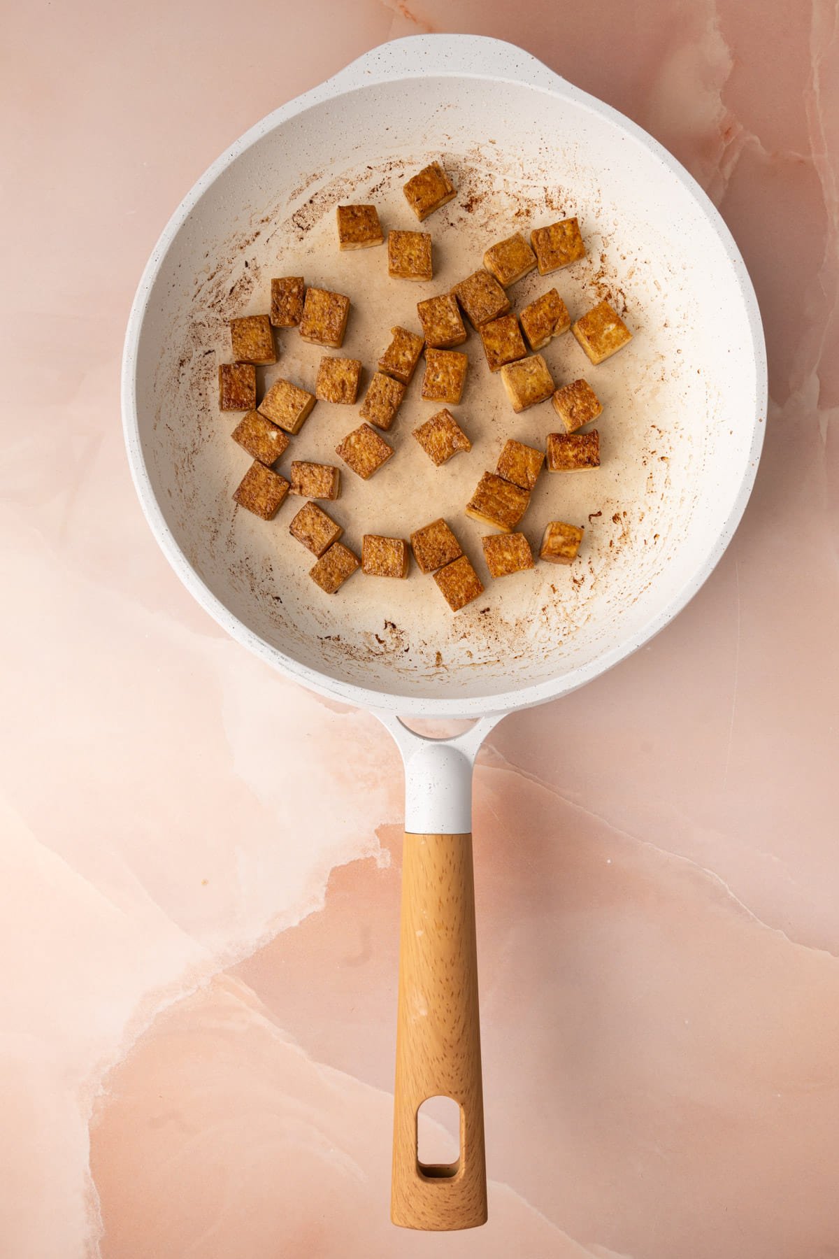 Crispy pan-fried tofu tossed with soy sauce. 