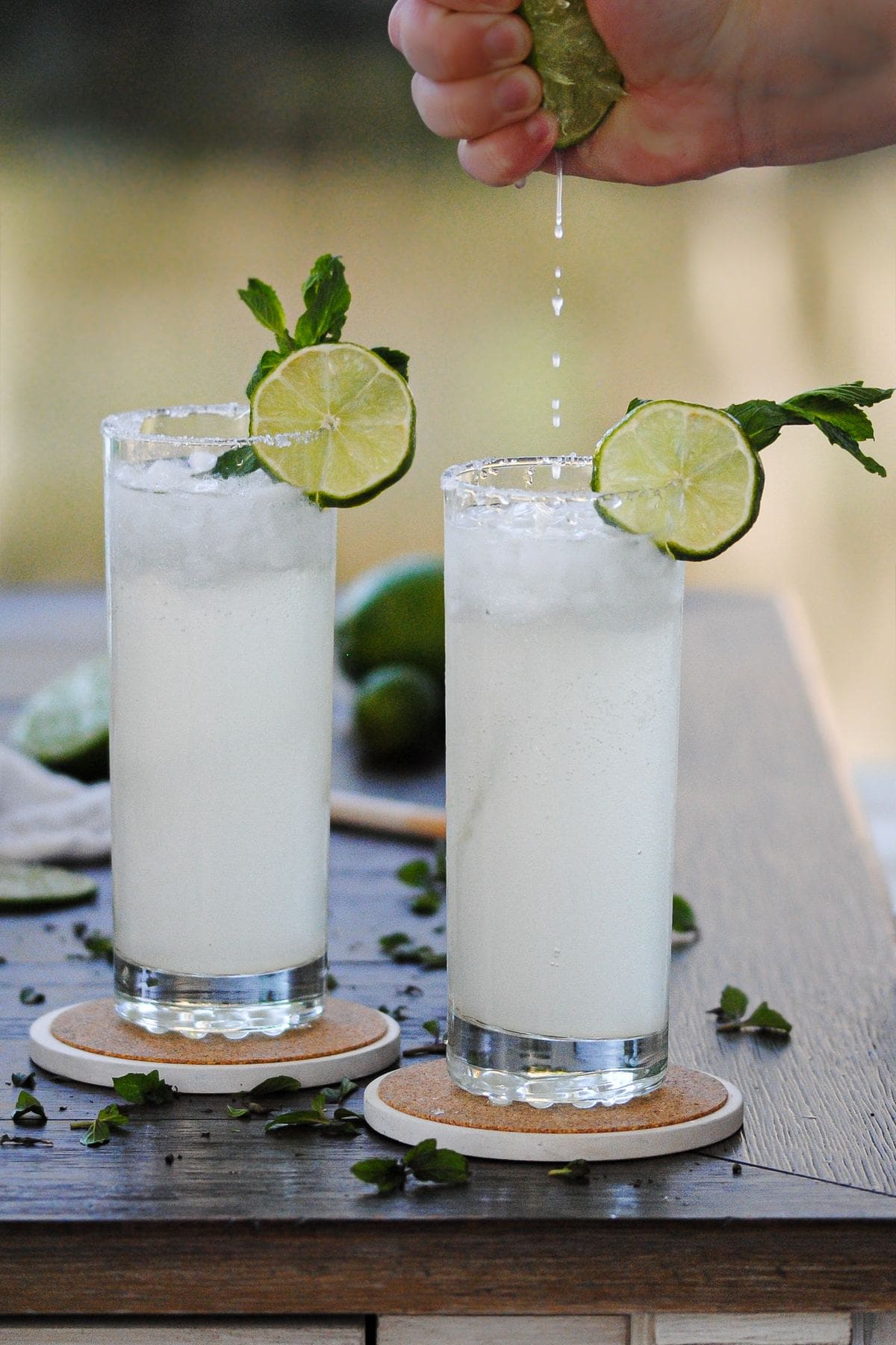 squeezing lime into a ginger beer cocktail