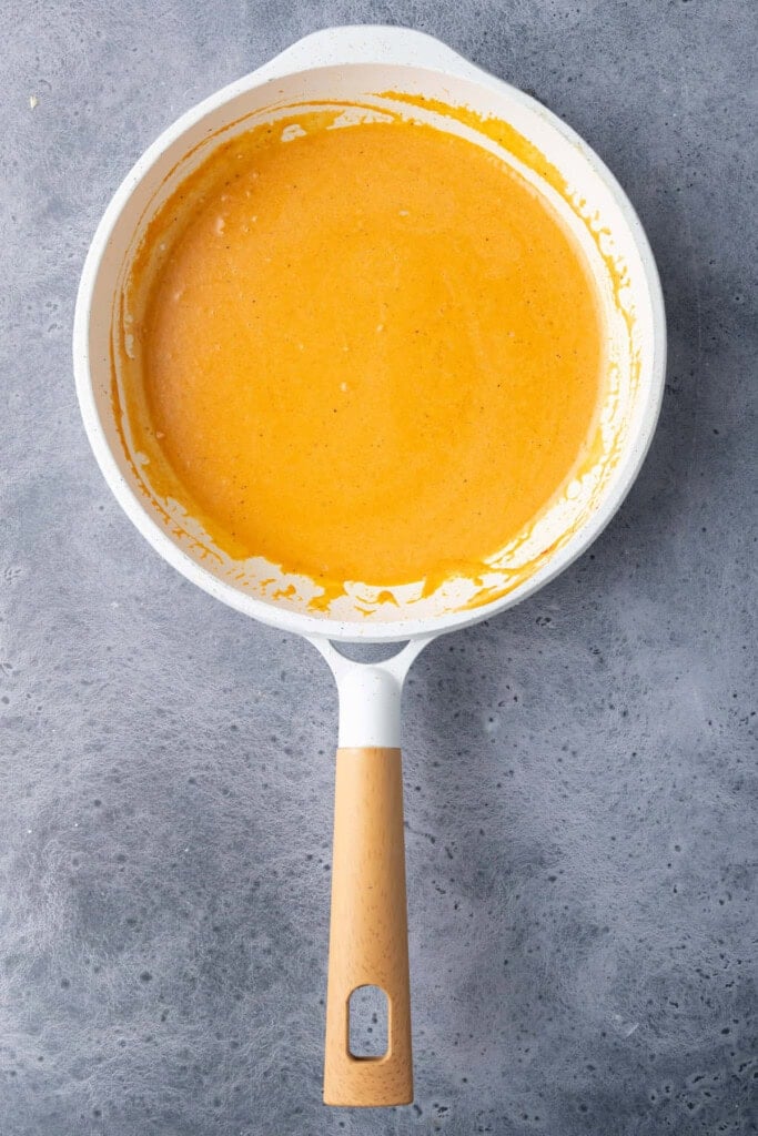 Sauce made from deglazed pan with garlic, tomato paste, and coconut milk.