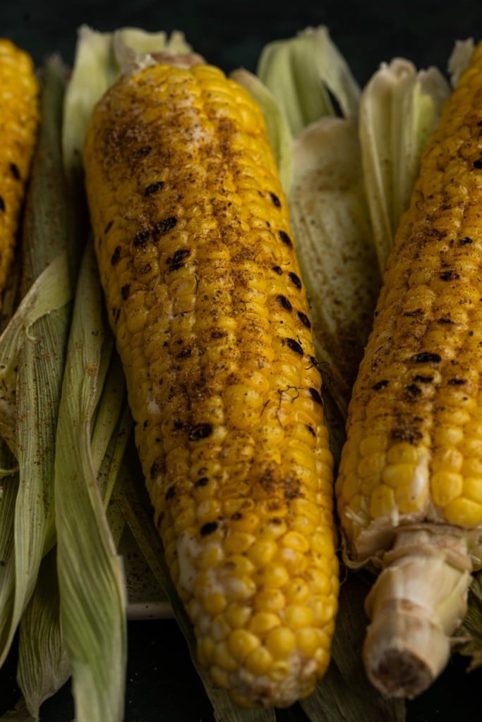 close up of grilled corn with old bay seasoning