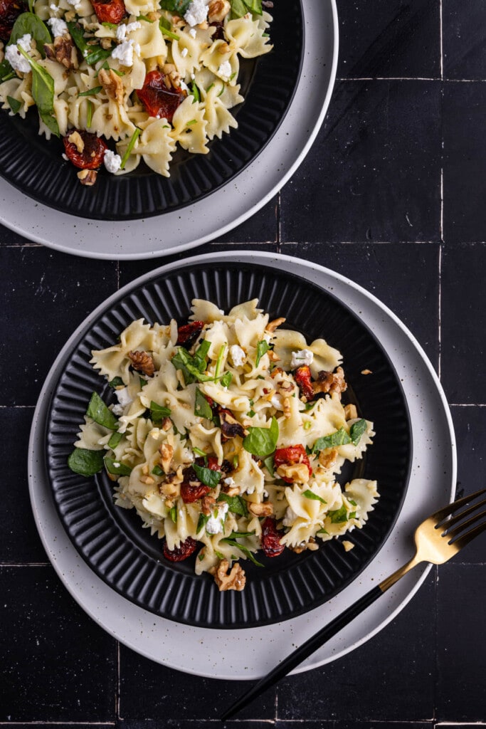 Two plates of Bow Tie Pasta Salad