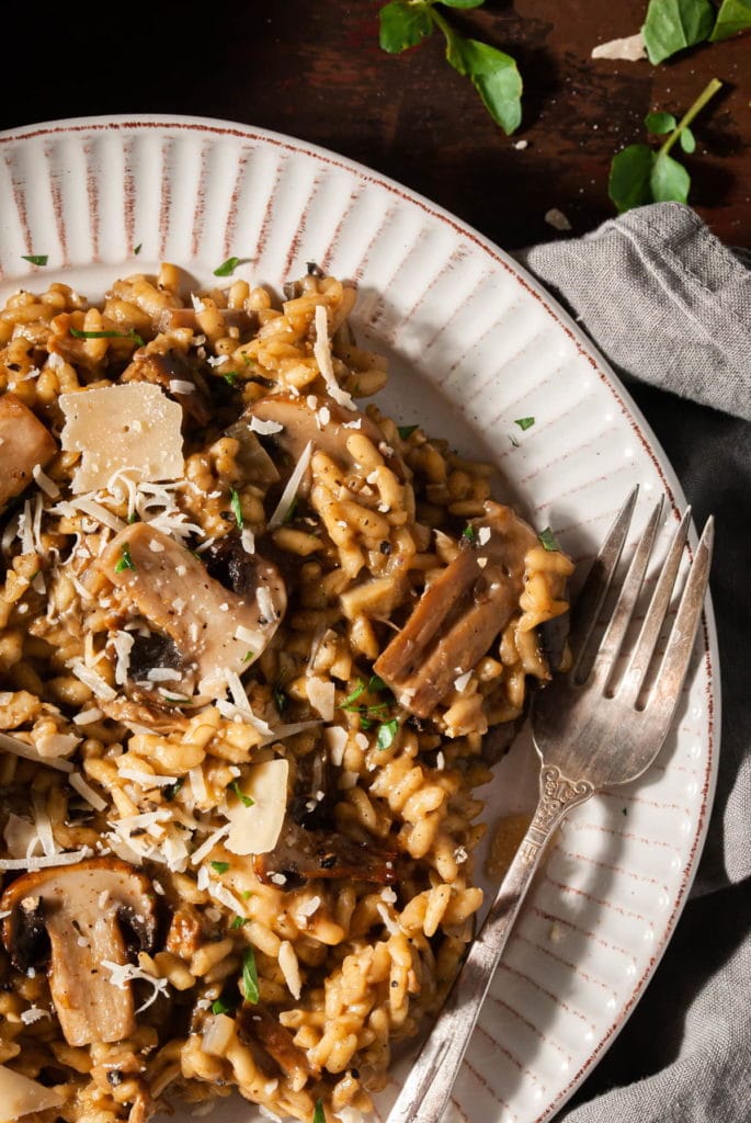 close up of a plate of gourmet truffle mushroom risotto