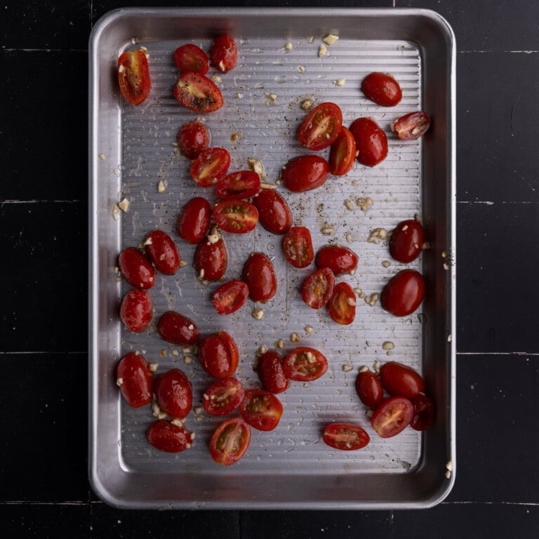 Roasting grape tomatoes with olive oil, salt, pepper, and minced garlic