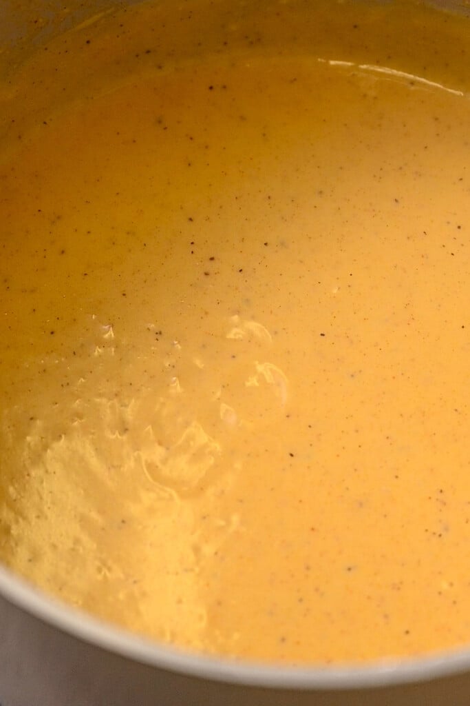 Thick Southern gravy hot in a pot on the stove.