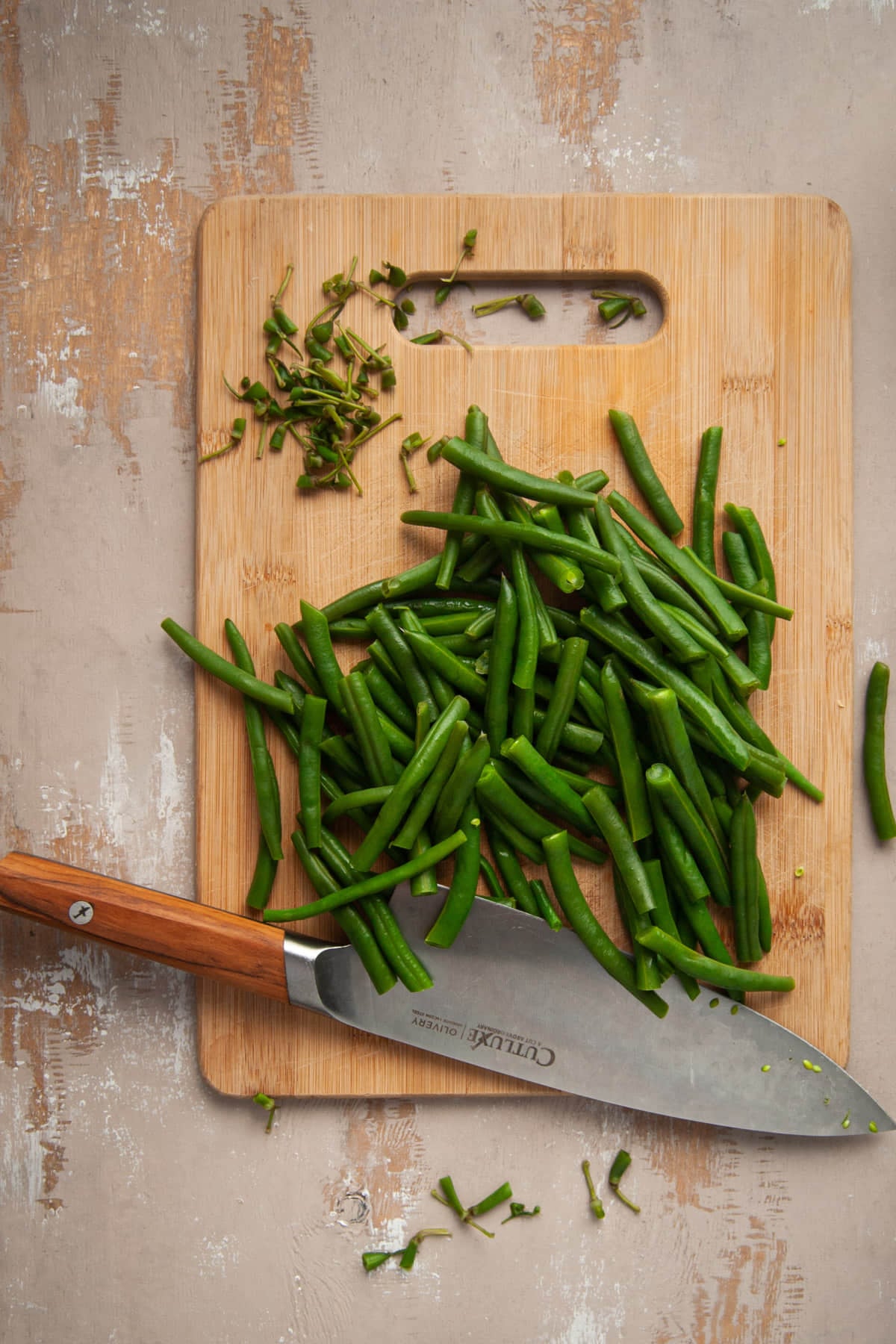 Trimming ends off of fresh green beans.