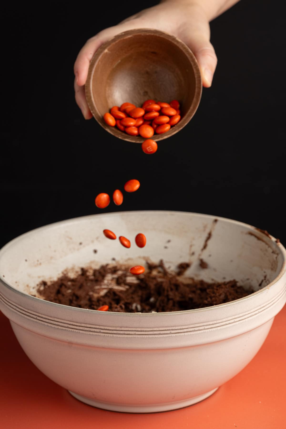 Adding orange M&M's only to chocolate cookie dough to make them Halloween festive