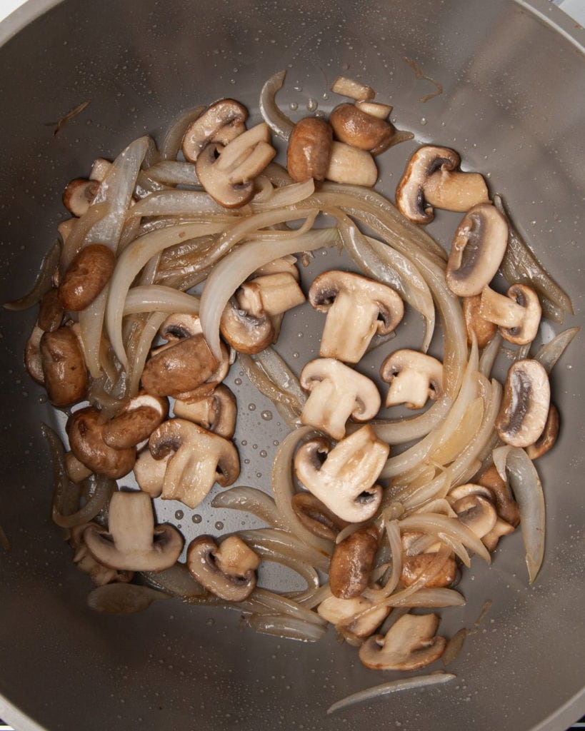 mushroom and onions caramelizing in olive oil
