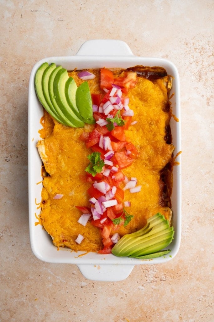 meatless enchiladas with homemade sauce and fresh toppings