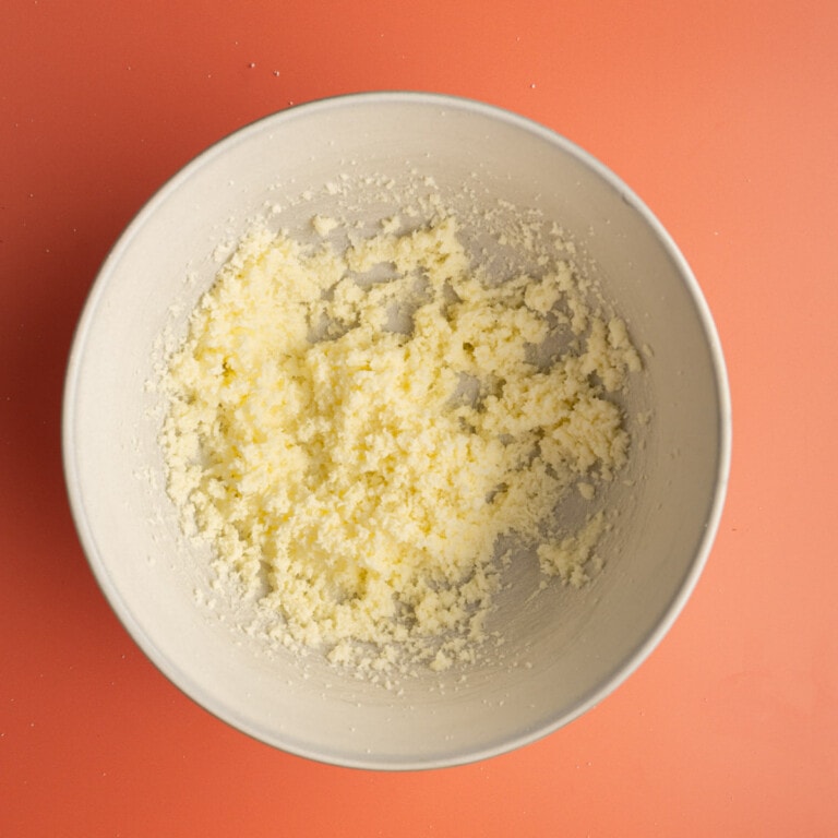 creamed butter and sugar in a white bowl