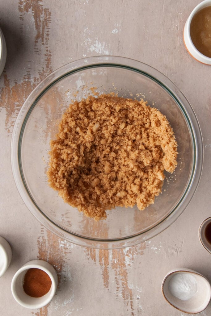 Coconut oil and light brown sugar creamed together in a mixing bowl.