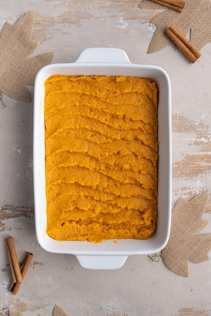 transferring the sweet potato to a casserole dish