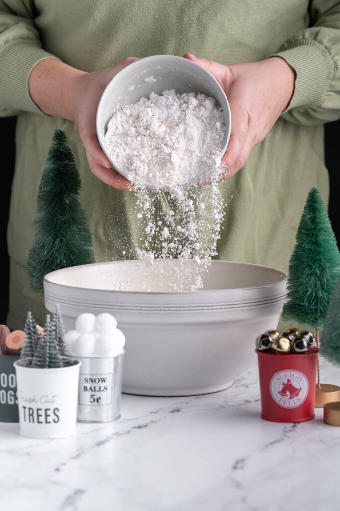 Adding flour to chocolate peppermint cookie dough