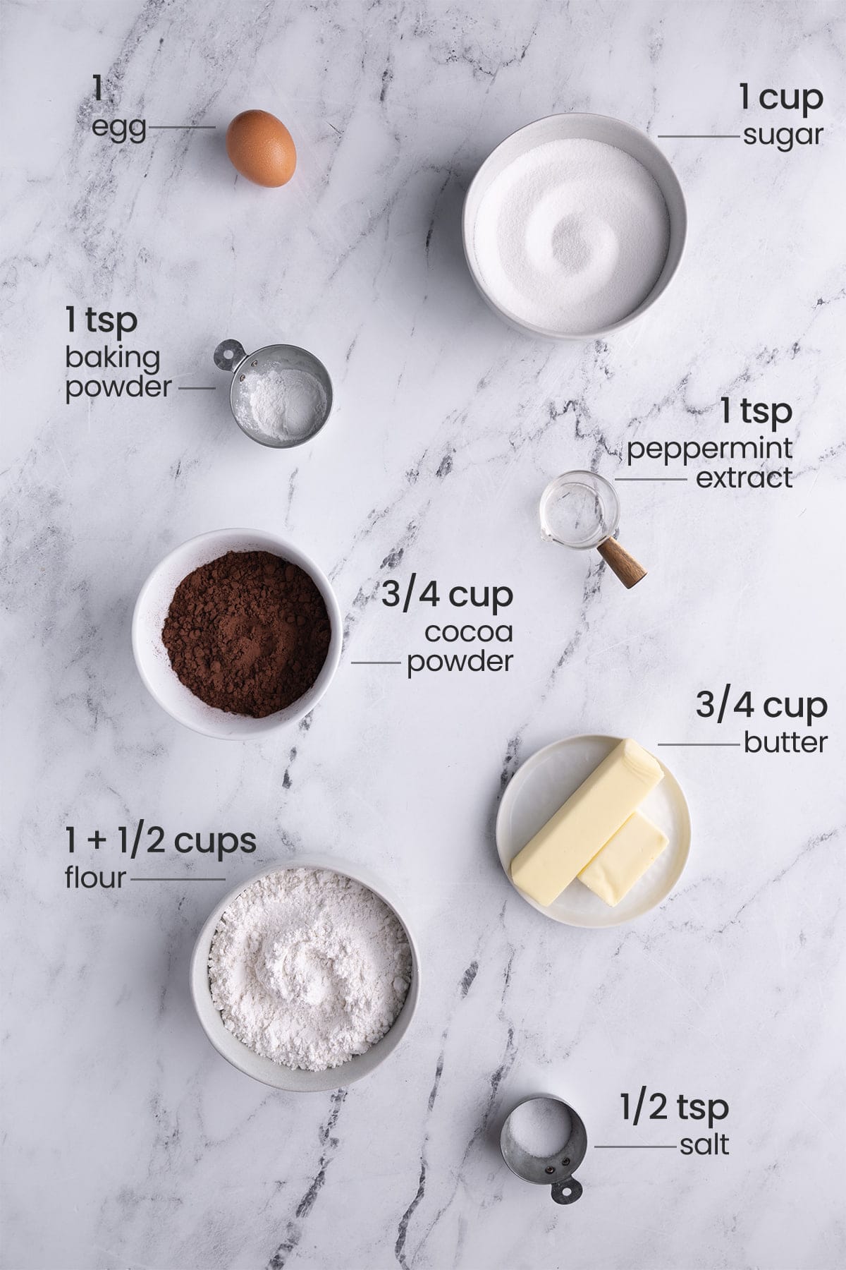 ingredients for Chocolate Peppermint Christmas Cookies - egg, sugar, baking powder, peppermint extract, cocoa powder, butter, flour, salt