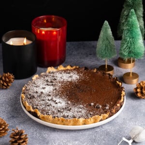 Baileys Hot Chocolate Tart with Christmas candles and tree decorations