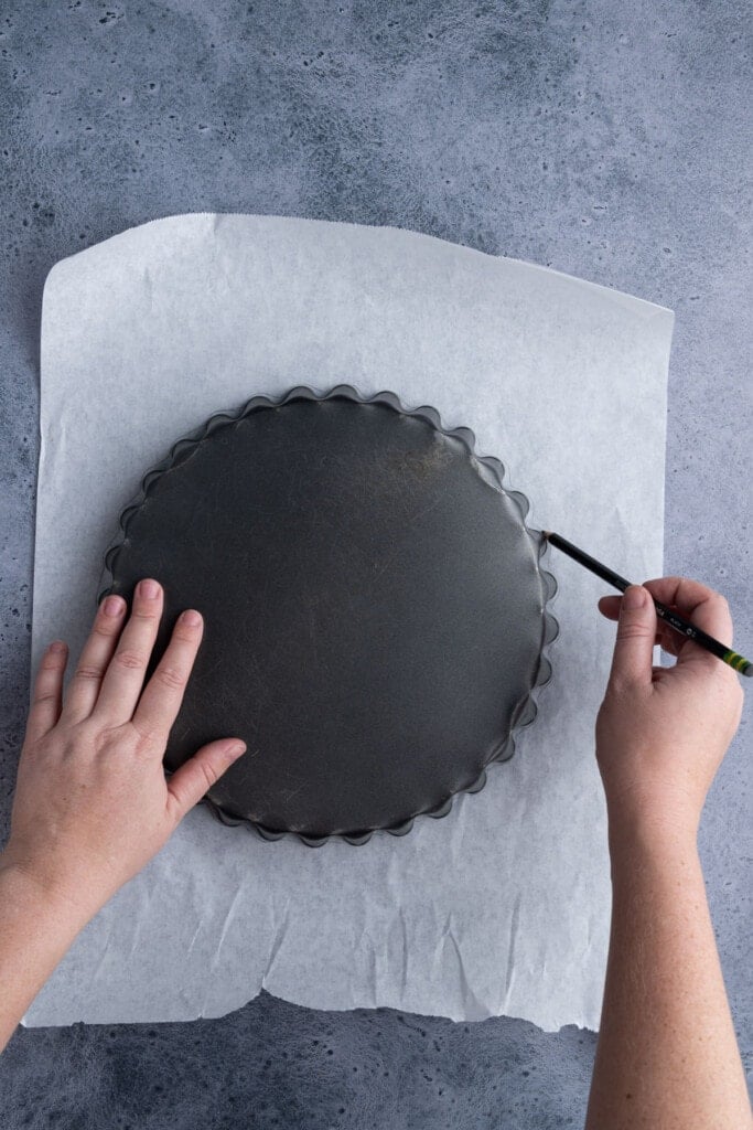 Tracing pie dish on parchment paper