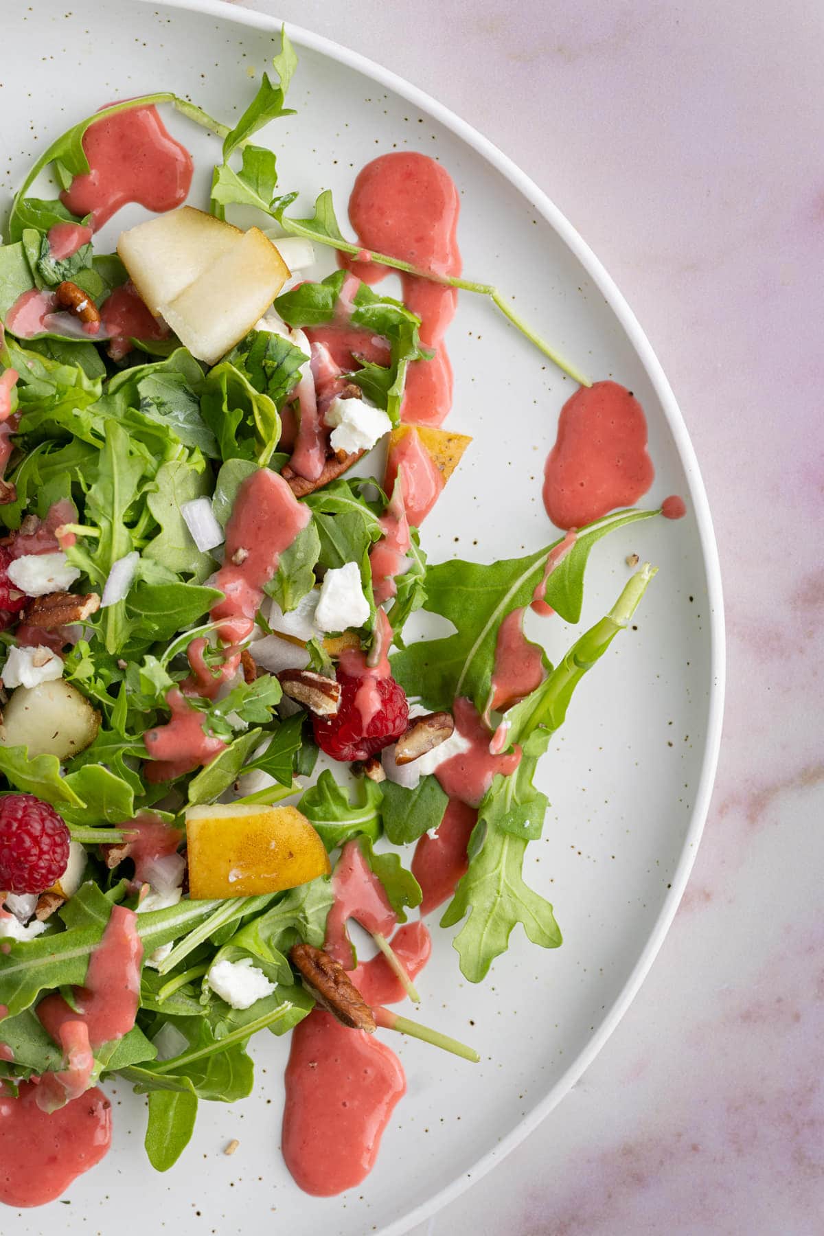 Fresh salad with bright pink dressing