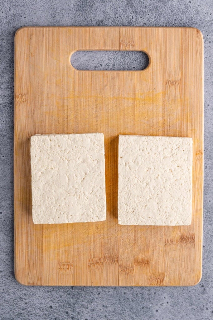 Block of tofu sliced in half lengthwise