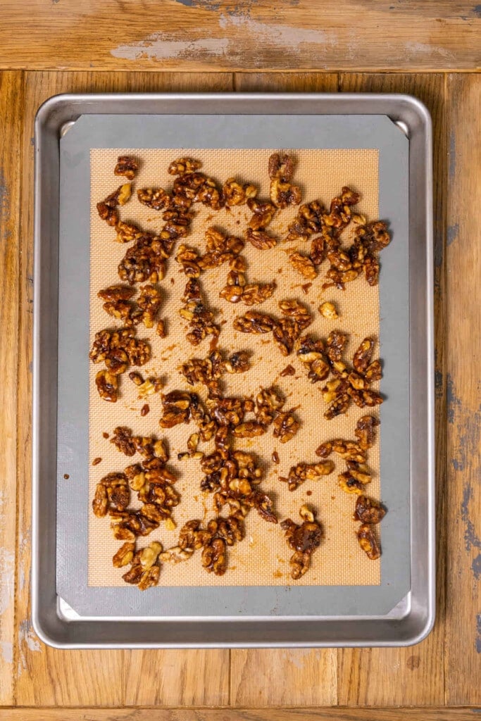 Walnuts covered with egg whites and cinnamon and sugar mixture ready for the oven