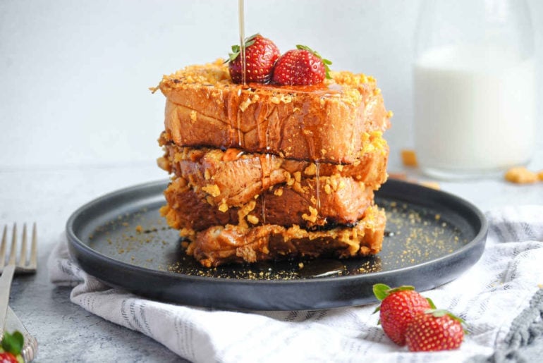 close up of stack of French Toast with syrup dripping down