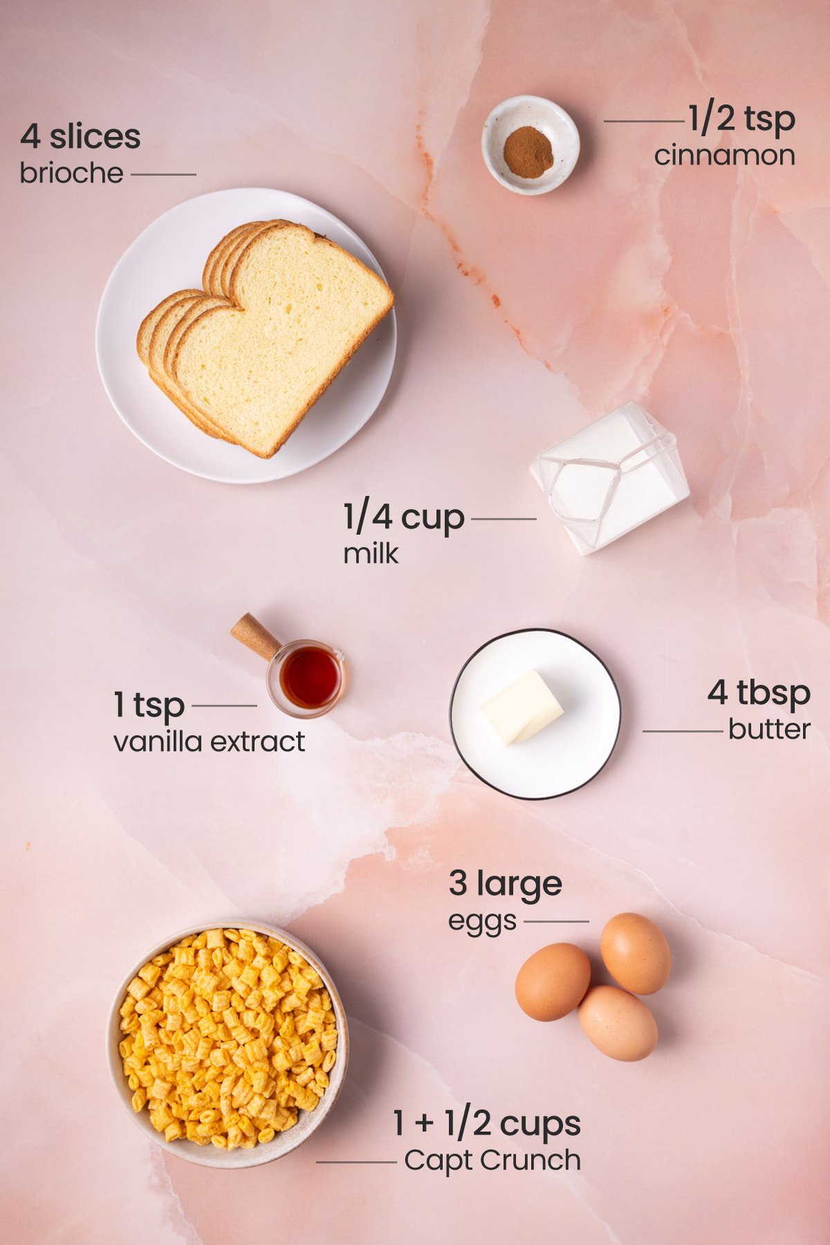 All ingredients needed for Captain Crunch French toast including cinnamon, bread, milk, vanilla extract, butter, eggs, and Cap'n Crunch. 