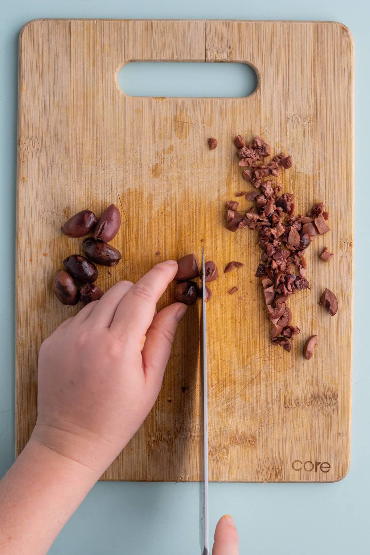 Dicing pitted Kalamata olives for Orzo Pasta Salad