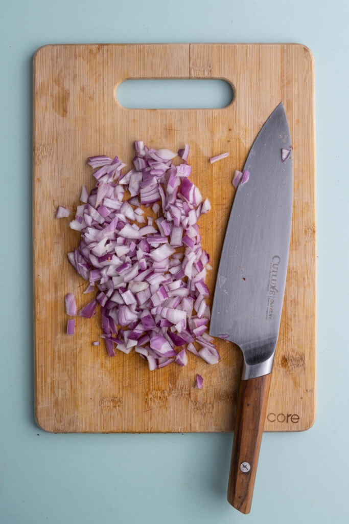 Dicing red onion into tiny pieces