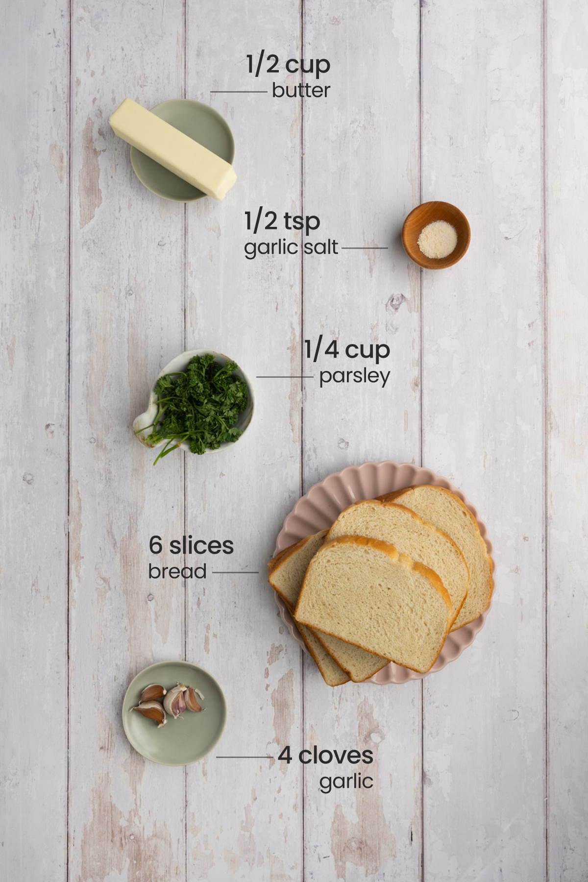 Texas Toast Garlic Bread ingredients including bread, garlic salt, parsley, unsalted butter, garlic, and olive oil