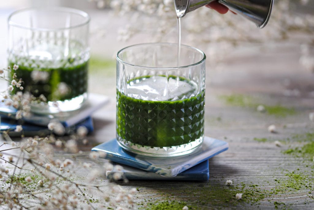 https://marleysmenu.com/wp-content/uploads/2021/03/The-Green-Irish-Matcha-Vodka-Cocktail-Pouring-In-Vanilla-Liquer-1024x685.jpg