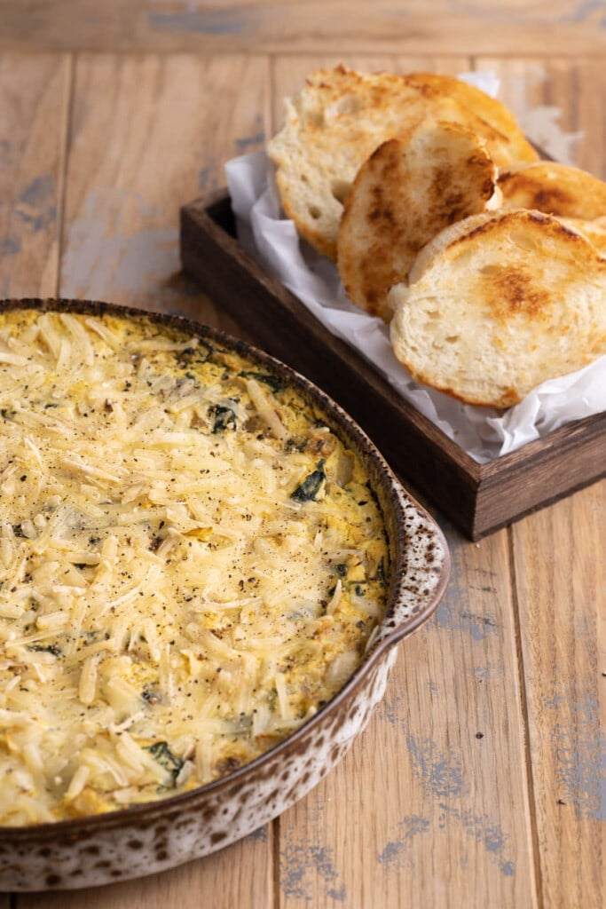 Creamy Vegan Spinach Artichoke Dip served with toasted bread