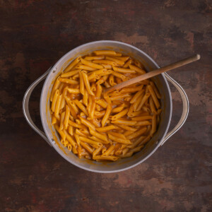 Penne pasta cooked al dente in pumpkin and broth