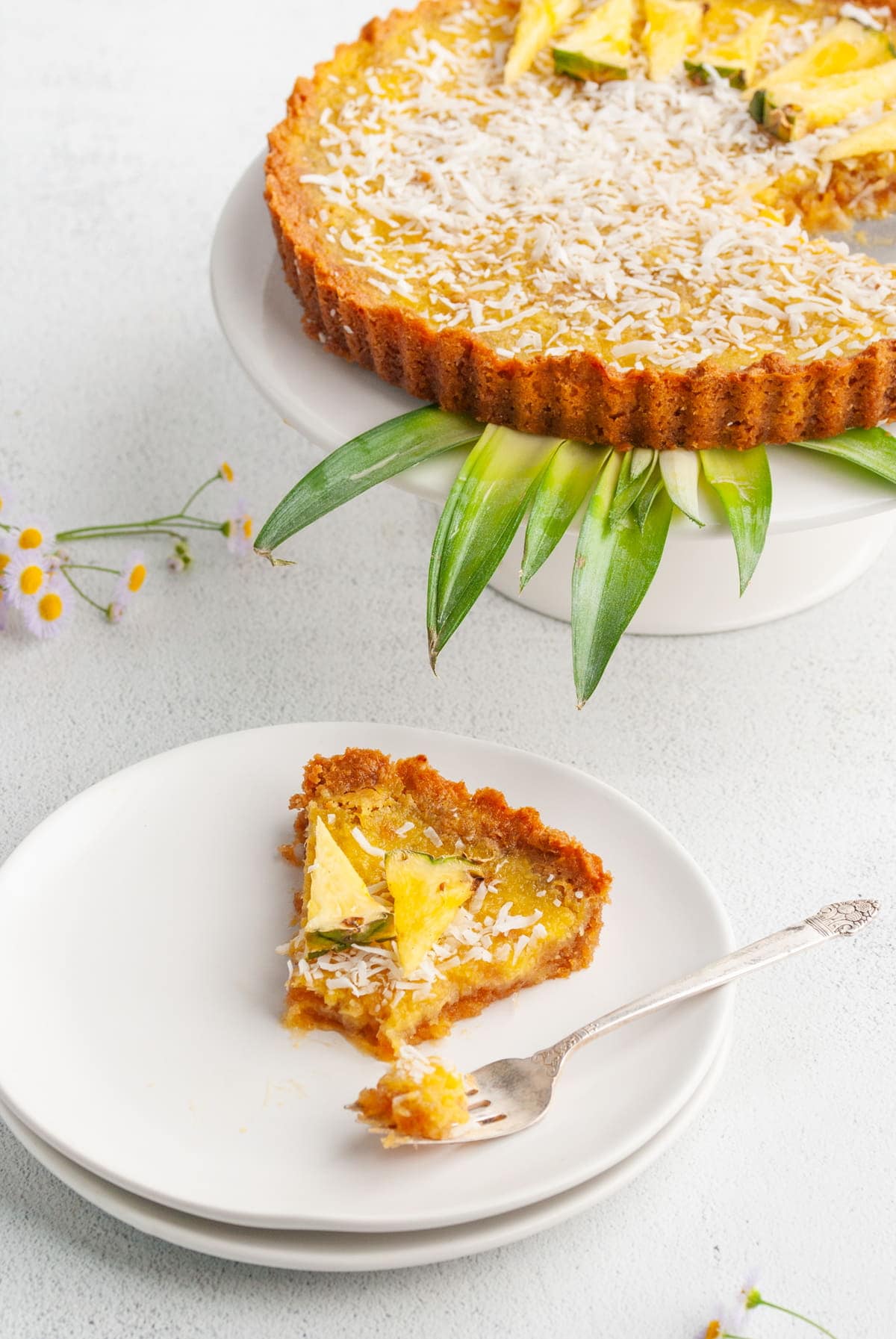 slice of pineapple pie with forkful taken out