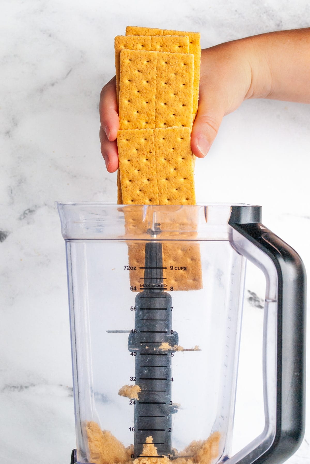 adding graham crackers to blender