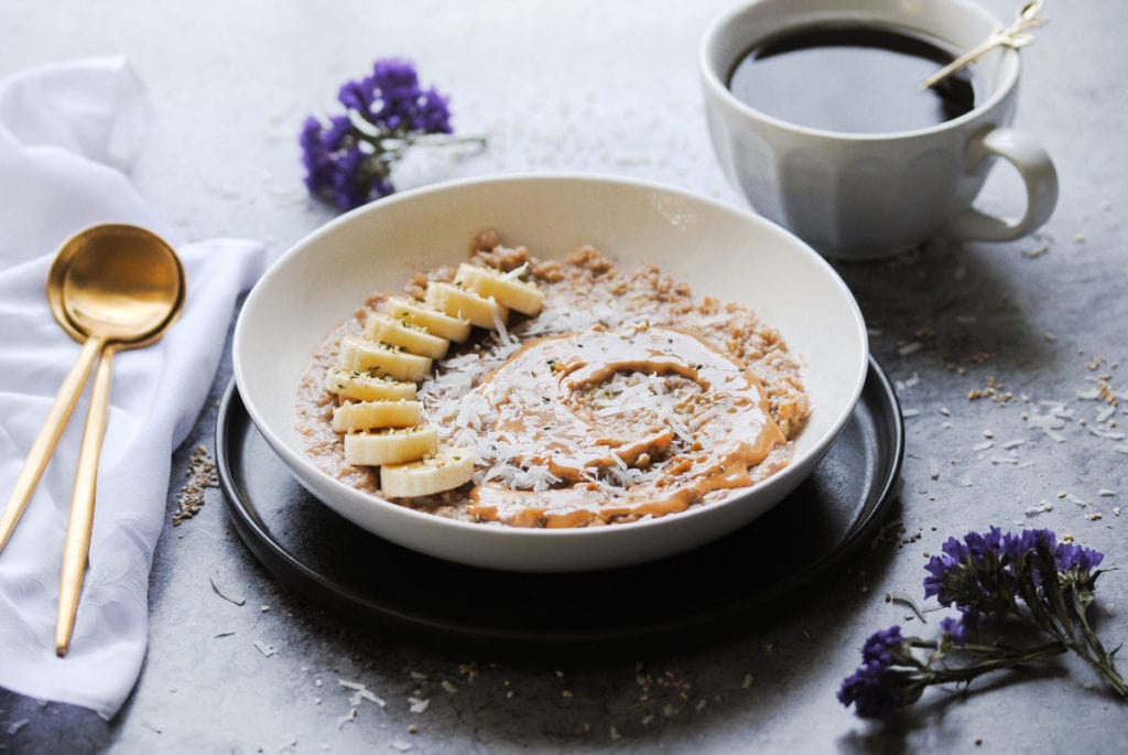 angled shot of breakfast scene with porridge and coffee